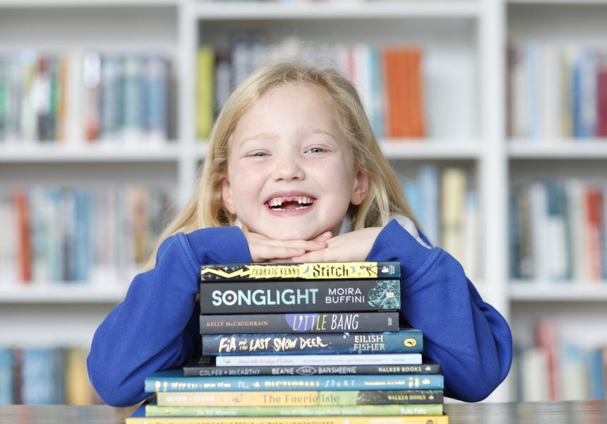 Mae Richardson with the 2025 KPMG Children's Books Ireland Award titles 
