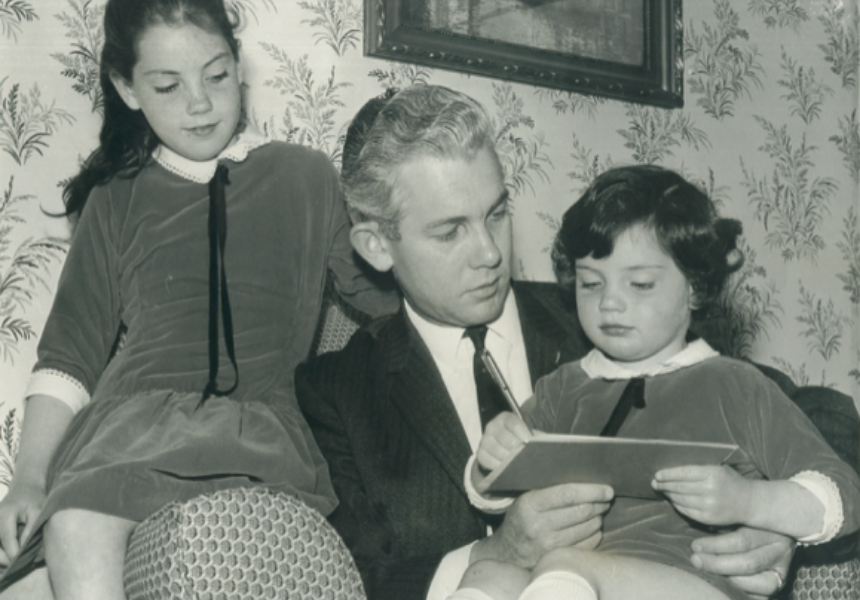 Phillip reading to his daughters